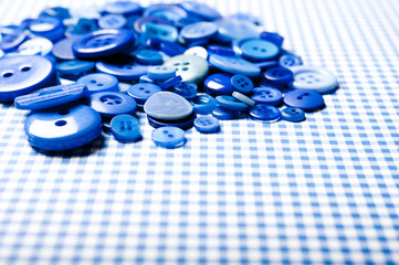 a pile of blue buttons with copy space like sewing background 