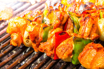 Grilled skewers of vegetables and meat on the grill.