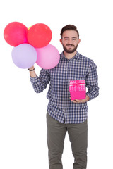 holding gift and balloons