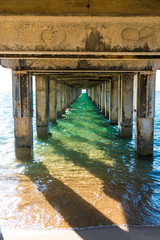 Underneath pier looking out into the ocean