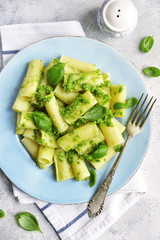 Rigatoni pasta with basil pesto.Top view.