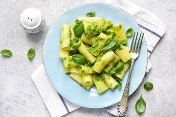 Rigatoni pasta with basil pesto.Top view.