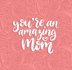 You Are An Amazing Mom vector calligraphy. Happy Mothers Day hand lettering illustration on abstract background.