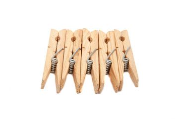 wooden clothes pegs isolated on the white