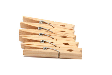 wooden clothes pegs isolated on the white