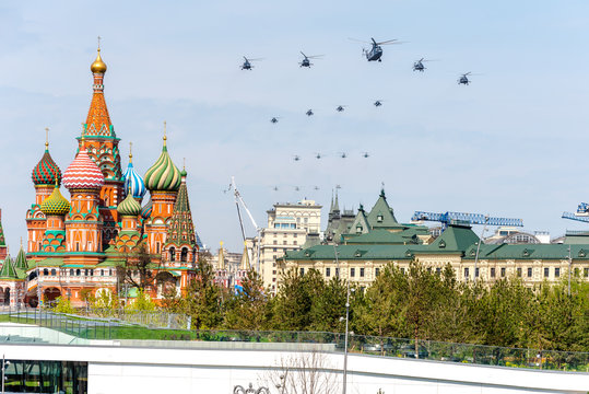 Moscow, Russia-may 4, 2018: a Group of Russian military helicopters in the sky at a rehearsal parade for Victory day. View of the Red square, St. Basil's Cathedral from Zaryadye Park.