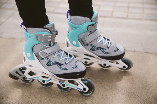 Close-up view of female legs on roller skates