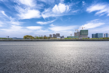 empty asphalt road with modern office building