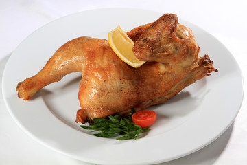 Tasty cooked chicken on white plate