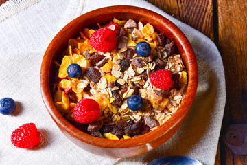 rustic muesli breakfast with forest fruits