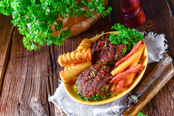 grilled bullets with croquettes and vegetables