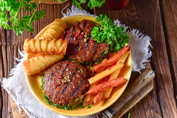 grilled bullets with croquettes and vegetables
