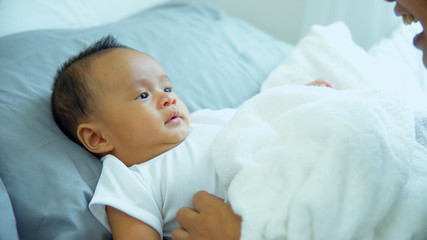 Little baby attention to listen with grandma is speaking