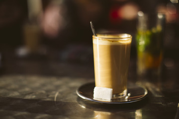 Coffee in a glass on a terrace in Tetouan, Morocco.