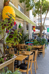 Restaurant tables on the sidewalk