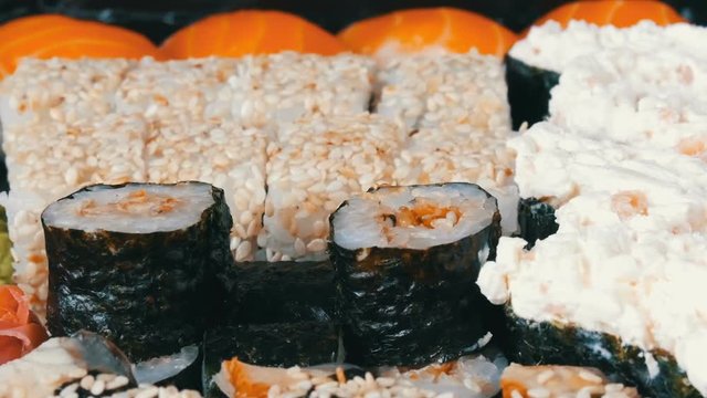 Stylish fresh sushi set with various kinds of sushi rolls, close up