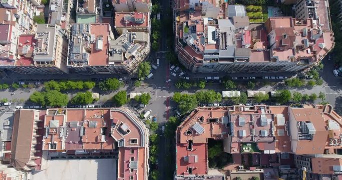 Aerial top view of Barcelona Eixample district street and buildings, urban area, Spain