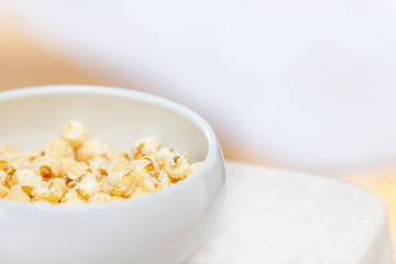 big white bowl full of popcorn