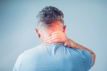 Young man suffering from neck pain. Headache pain.