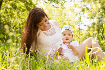 happy loving mother and her baby outdoors