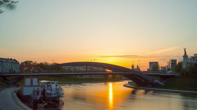 Vilnius, Lithuania - circa May, 2018: Bridge of King Mindaugas at sunset, time-lapse