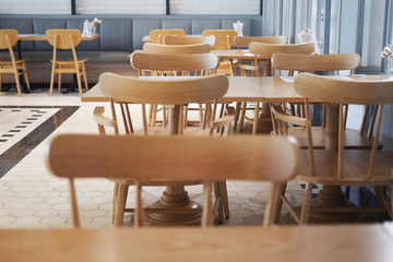 Wooden tables with chairs in a restaurant