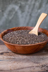 Chia seeds in a wooden spoon on the table