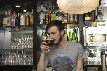 waiter in the pub with beer glass
