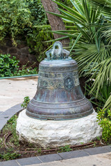 Bell in garden in The Greek Orthodox Church of the Twelve Apostles, Israel