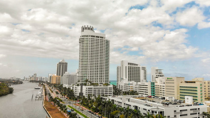 Obraz premium MIAMI BEACH, FL - APRIL 11, 2018: Aerial skyline of Miami Beach on a spring day. The city attracts 20 million tourists annually