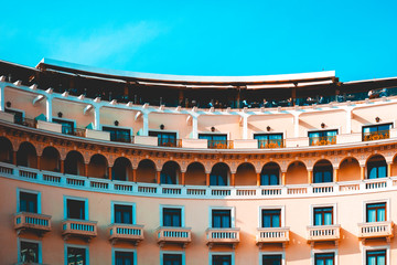 Obraz premium curved building with long orange balcony