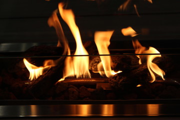 Flickering flames in fire and reflection. 