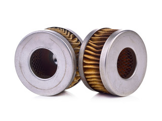 Old automotive oil filter cartridge isolated on a white background.