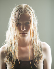 Albino woman with wet blond long hair. Sensual woman with natural beauty look and no makeup. Girl...
