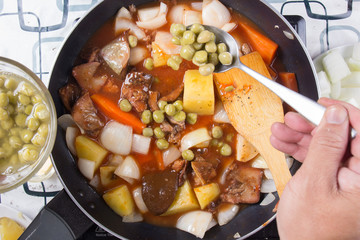 Chef putting peas for cooking