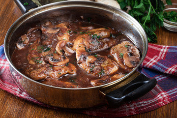 Delicious chicken marsala on frying pan