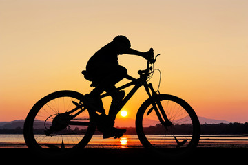 Fototapeta na wymiar People cycling at the beach twilight time