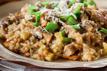 Risotto with champignon mushrooms, pork and parmesan