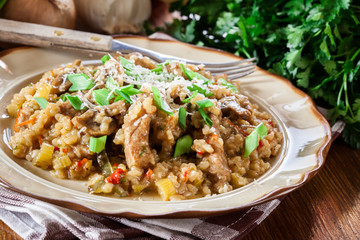 Risotto with champignon mushrooms, pork and parmesan