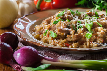 Risotto with champignon mushrooms, pork and parmesan