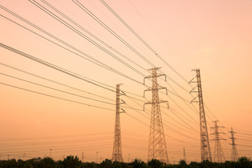 silhouette high voltage pole on sky sunset background.