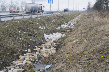 trash in a roadside ditch
