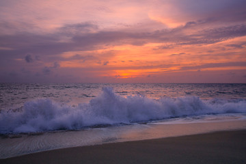 Fototapeta premium View of the sunset at Mai Khao Beach in Phuket, Thailand