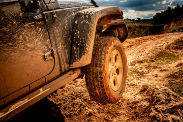 All-terrain vehicle leaving a wheel in the air.