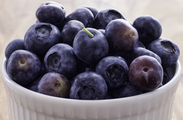 Closeup of White Bowl with Ripe Blueberries, Daylight, Background