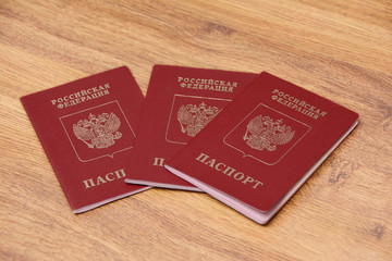 three international passports on a wooden background