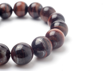 Tiger eye bracelet isolated on white background.