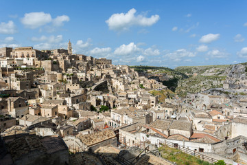 Fototapeta na wymiar Horizontal View of the City of Matera and the Sassi on Blue Sky Background