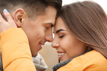 Beautiful couple in warm clothes outdoors