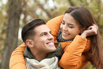 Beautiful couple in warm clothes outdoors